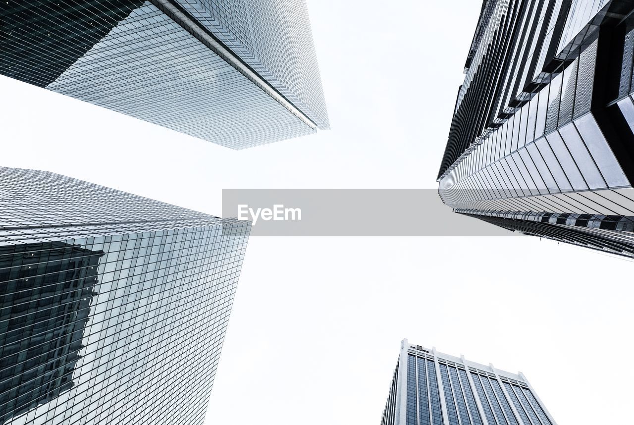 Low angle view of modern buildings against clear sky