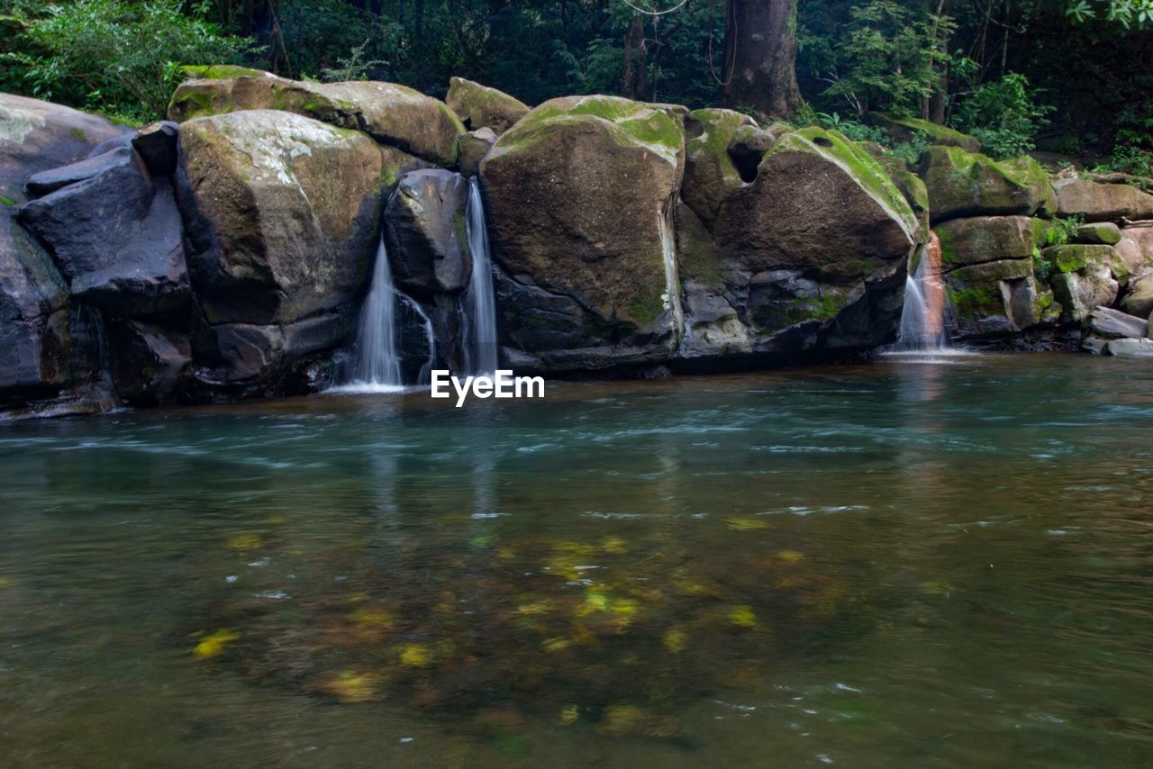 WATER FLOWING THROUGH ROCKS