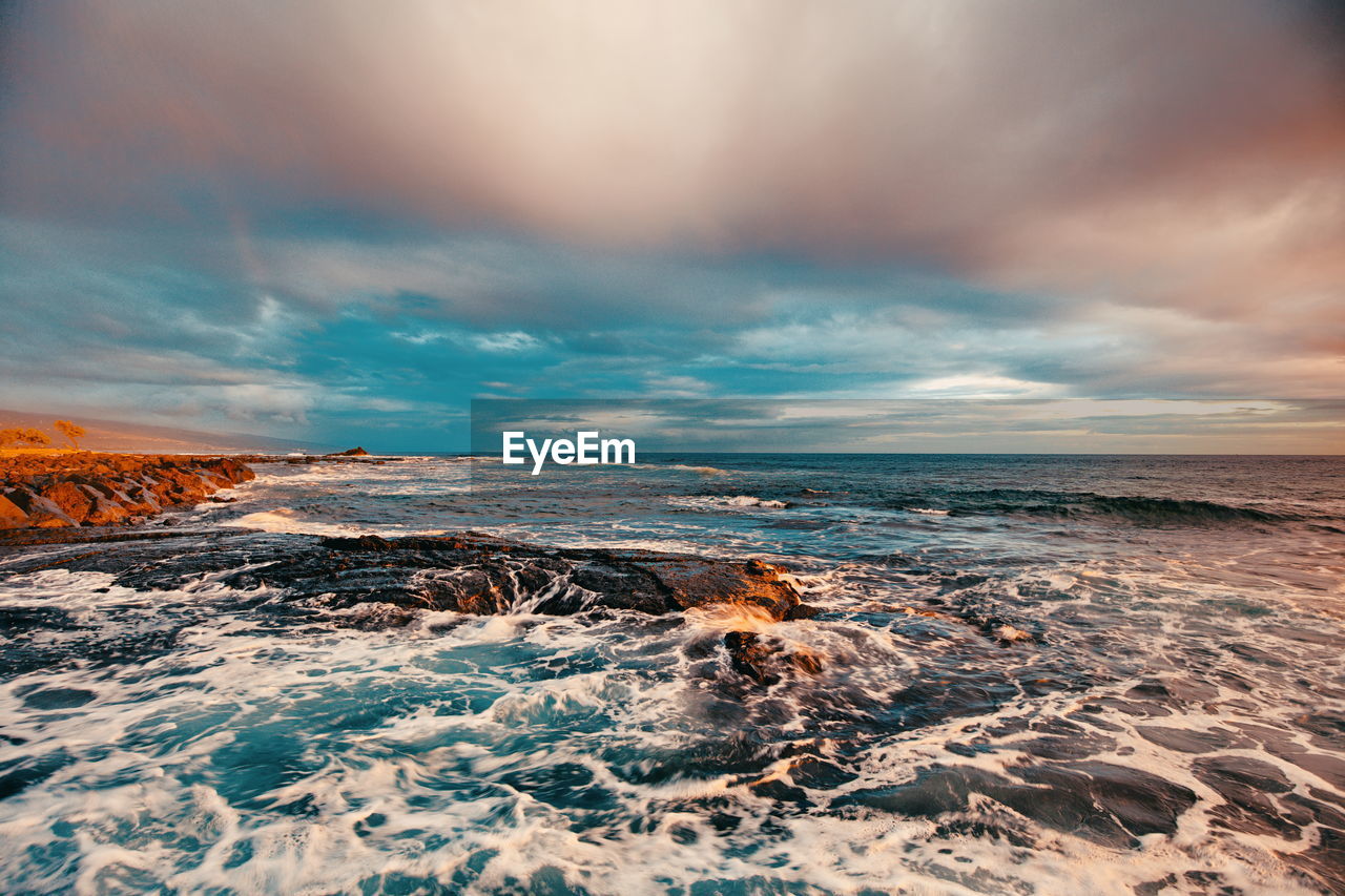 Scenic view of sea against sky during sunset