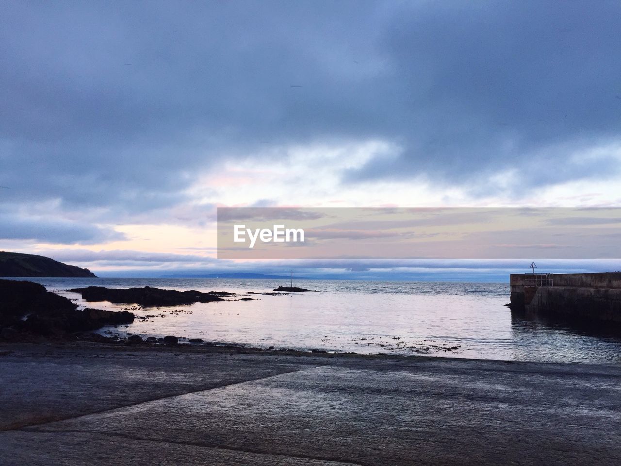 VIEW OF BEACH AGAINST SKY