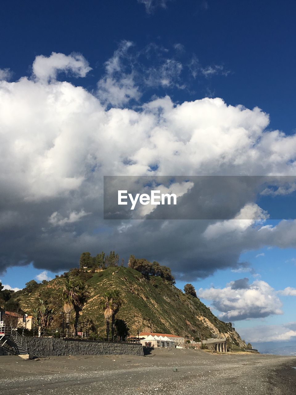 Scenic view of landscape against cloudy sky