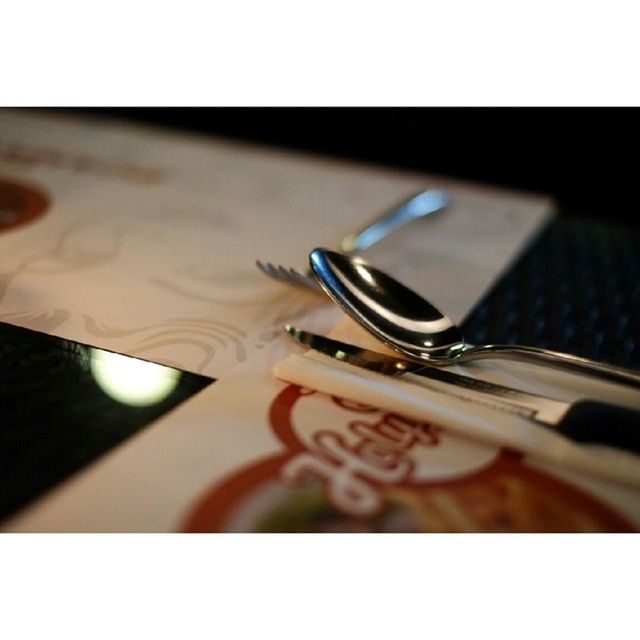 CLOSE-UP OF GLASSES ON TABLE