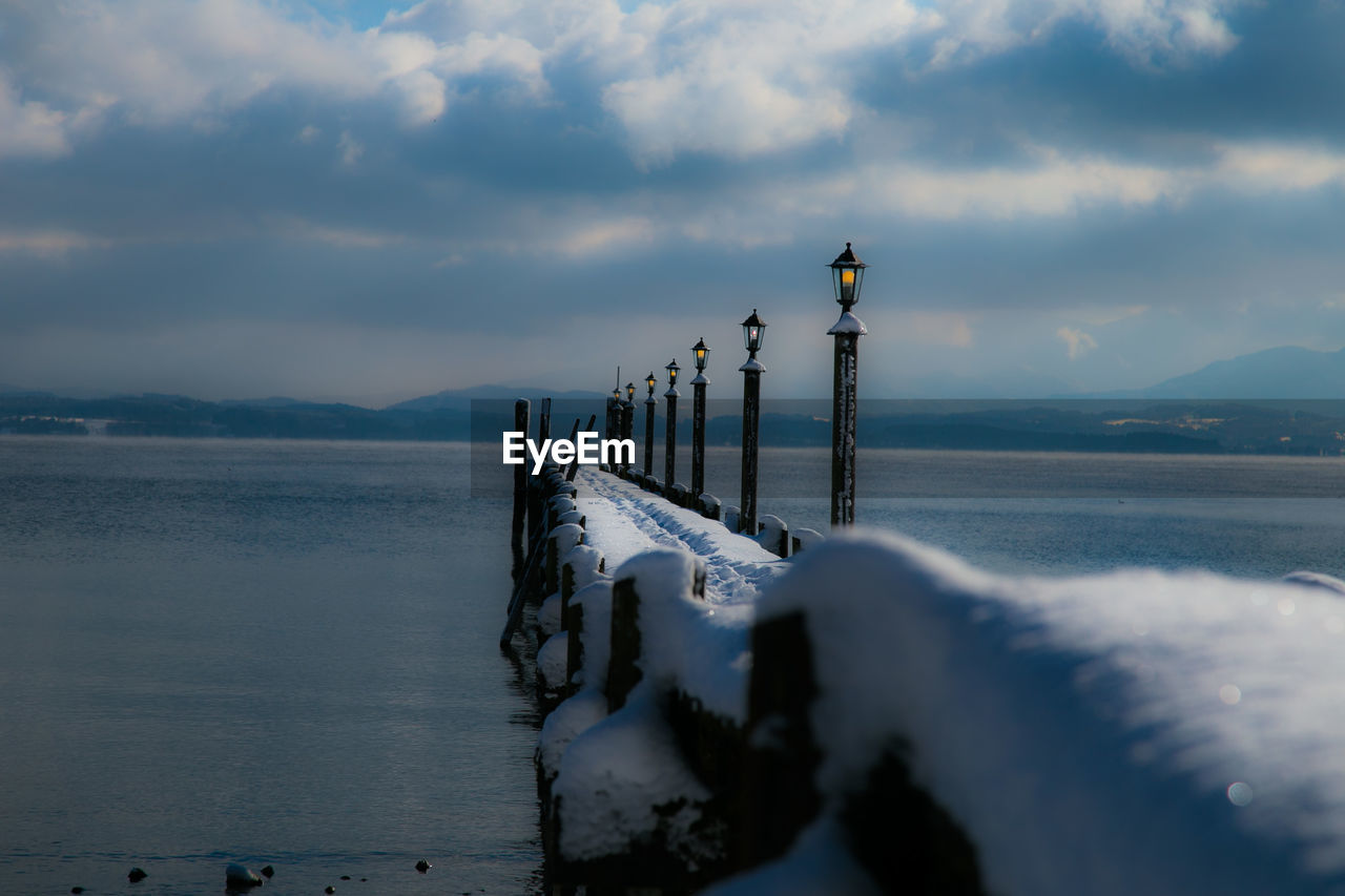 Scenic view of sea against sky during winter