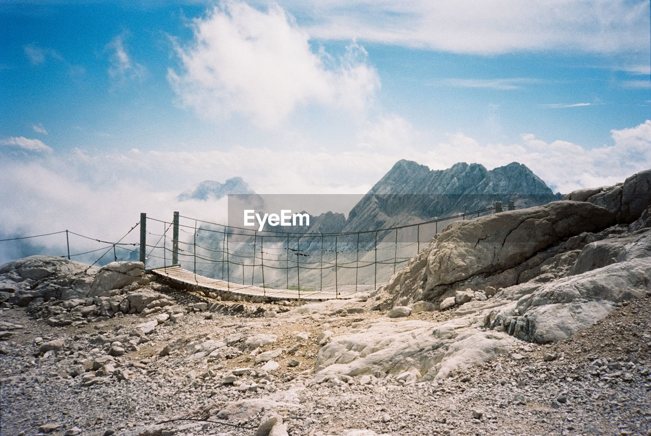 Panoramic view of bridge and mountains against sky