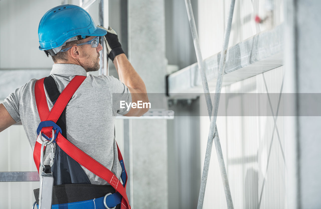 Low angle view of man working at site