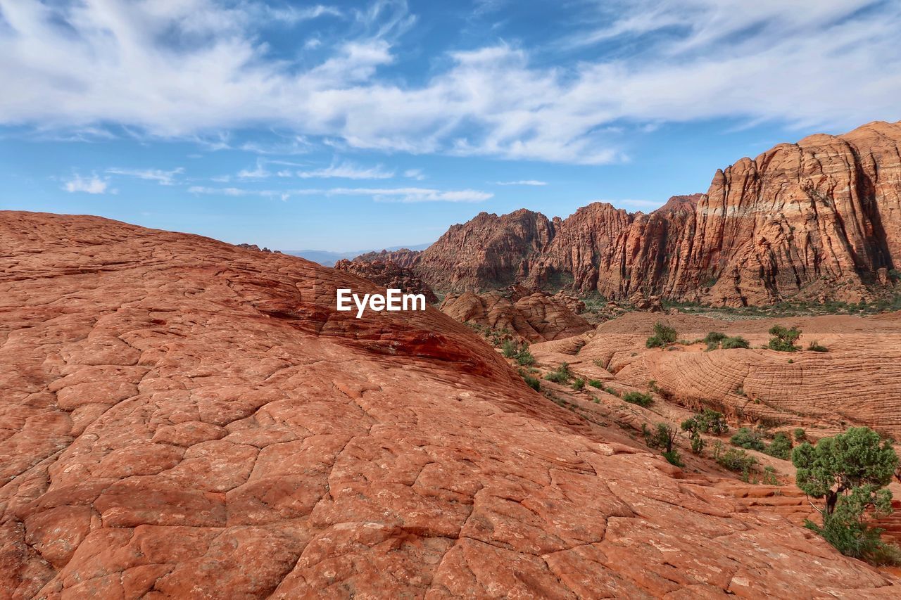 Rock formations on landscape against sky