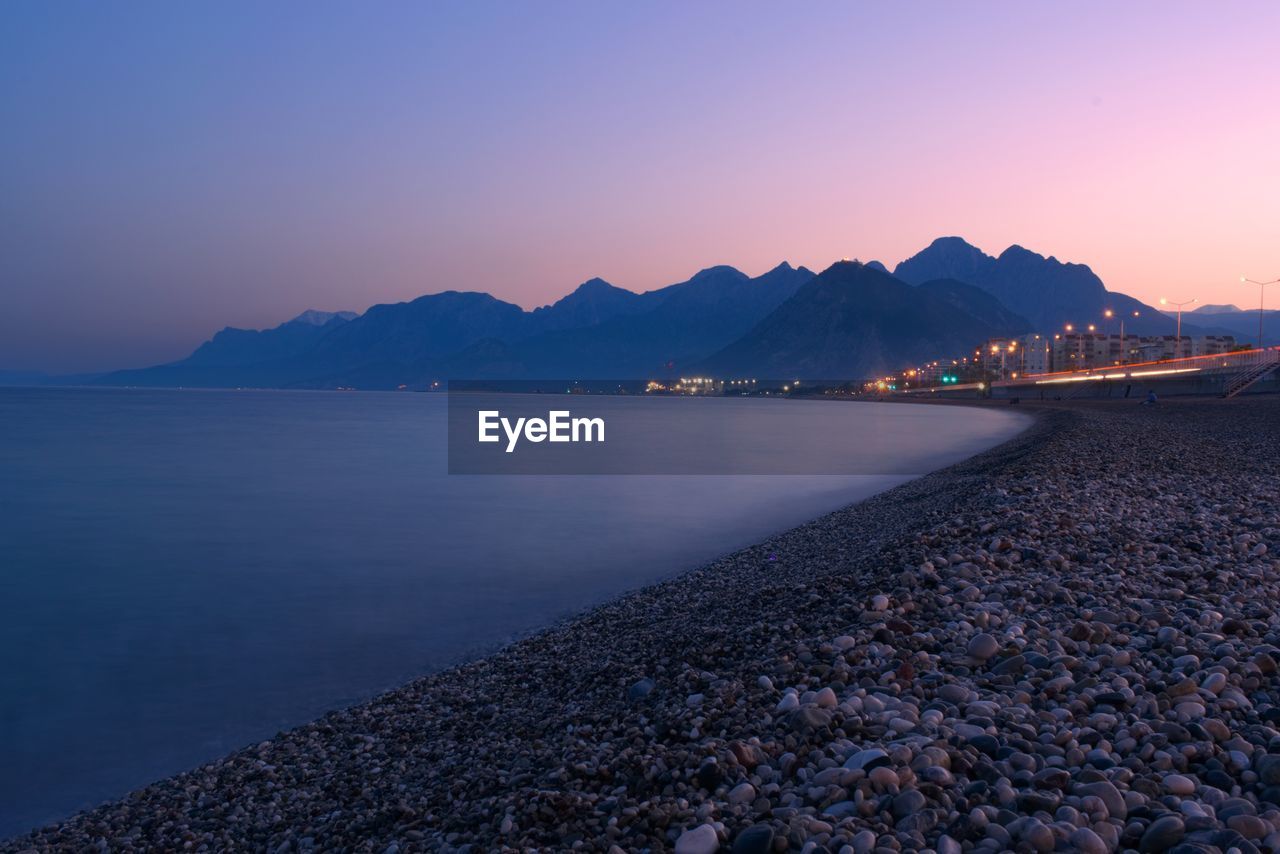 Scenic view of sea against clear sky during sunset