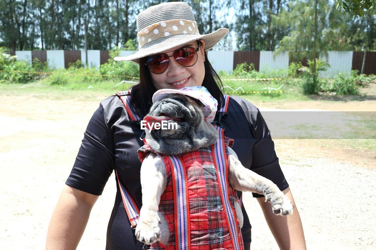 Smiling woman with dog