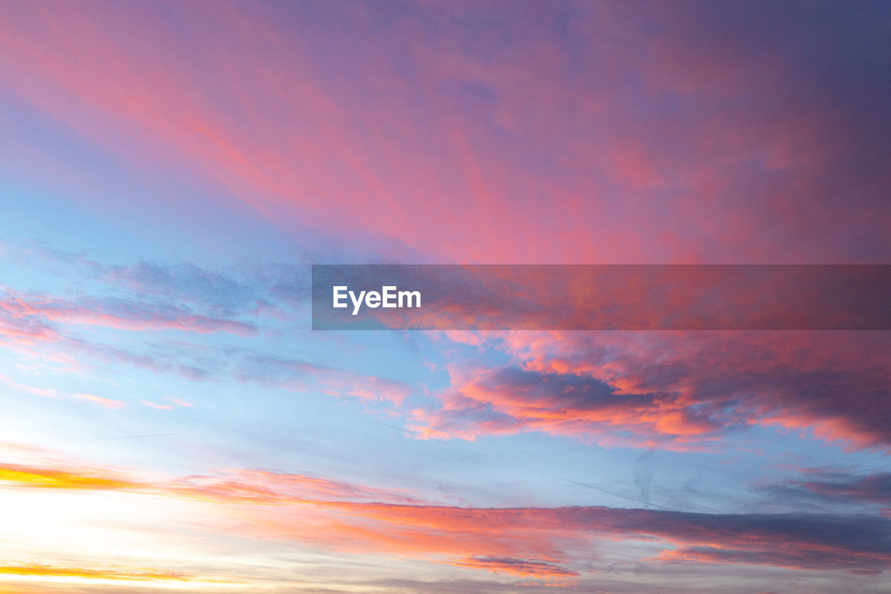 low angle view of cloudy sky during sunset