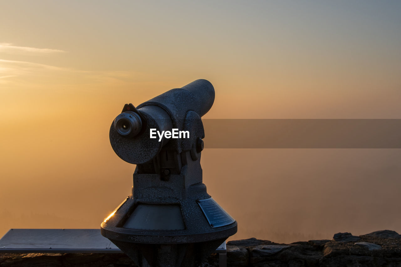 sky, sunset, binoculars, nature, astronomy, beauty in nature, screenshot, architecture, blue, scenics - nature, no people, landscape, travel destinations, environment, telescope, outdoors, optical instrument, cloud, light, sculpture, security, coin-operated binoculars, evening, sea, discovery, travel, land, surveillance