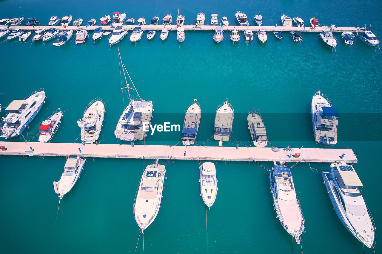 Aerial view of boats and yachts moored to jetty. yachts in marina