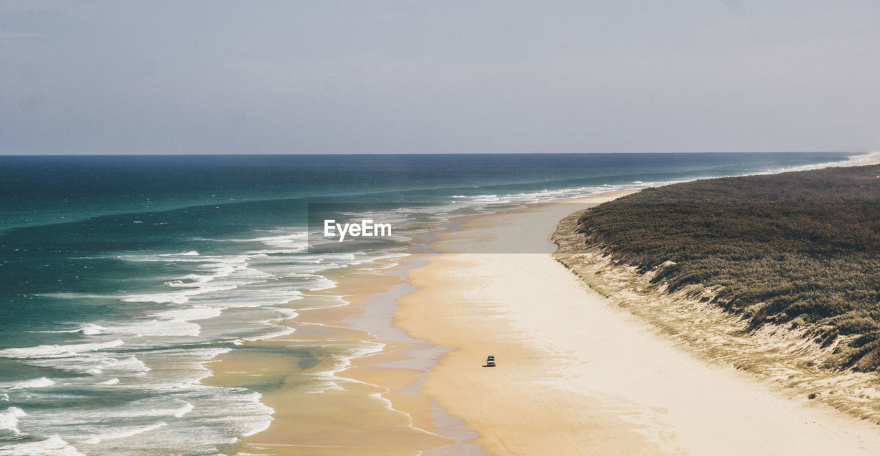 Scenic view of beach against clear sky