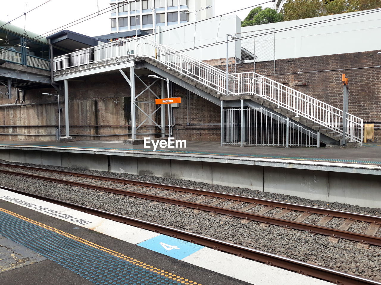 Train on railroad tracks against sky. this is sydney train service of australia.