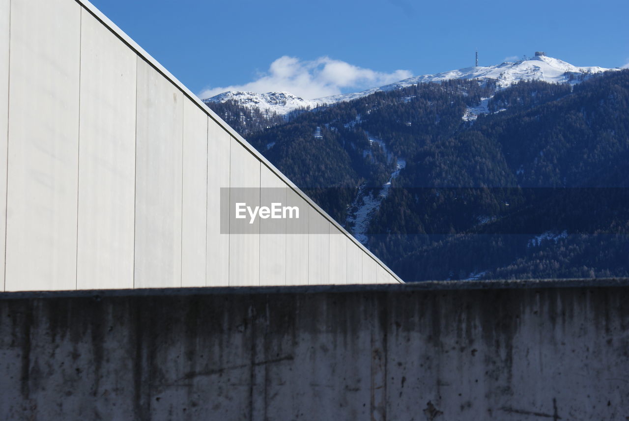 Scenic view of snow covered mountain against sky