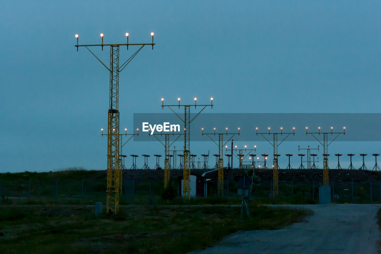 Towers at runway against clear sky