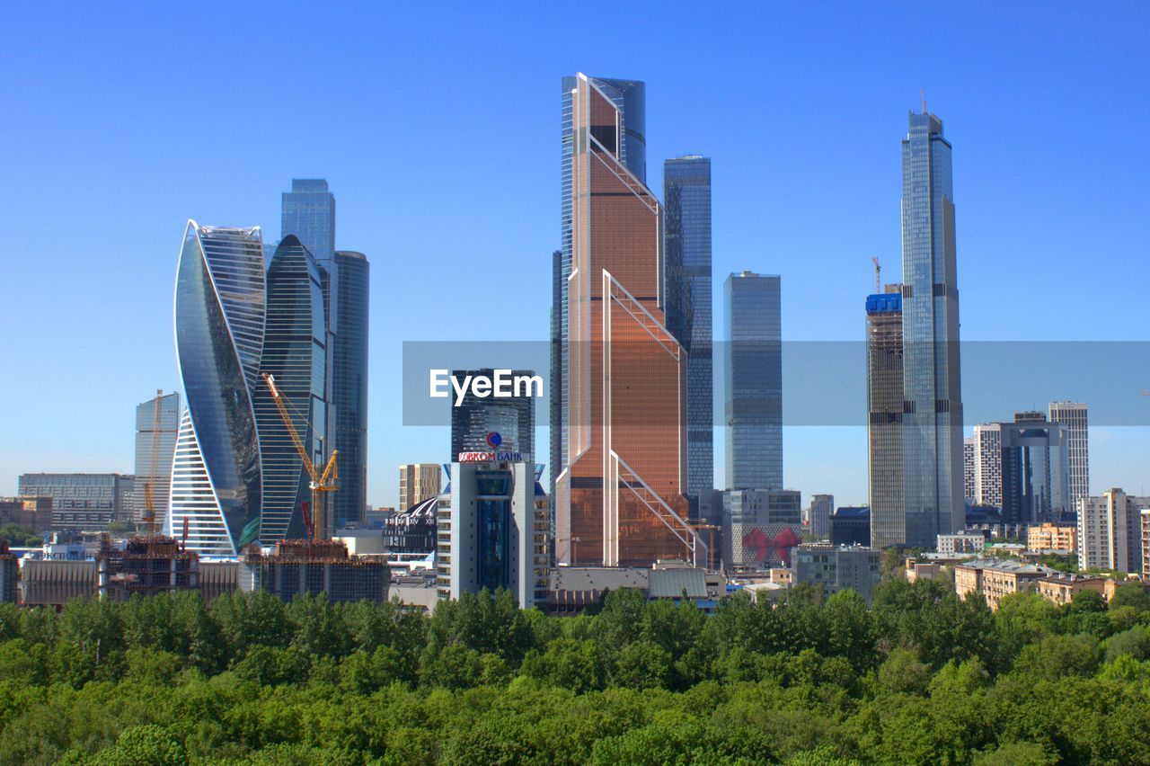VIEW OF MODERN BUILDINGS AGAINST SKY