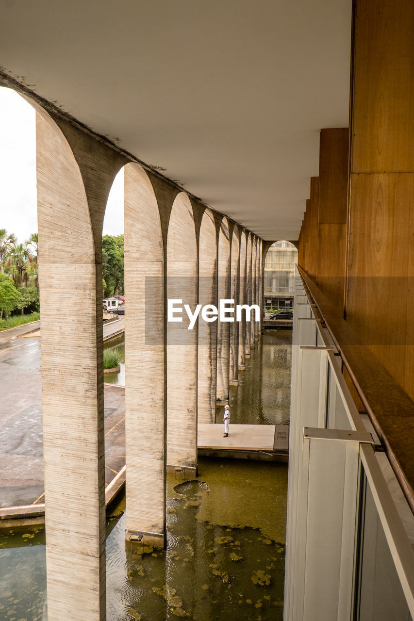 BRIDGE OVER RIVER SEEN THROUGH ARCH