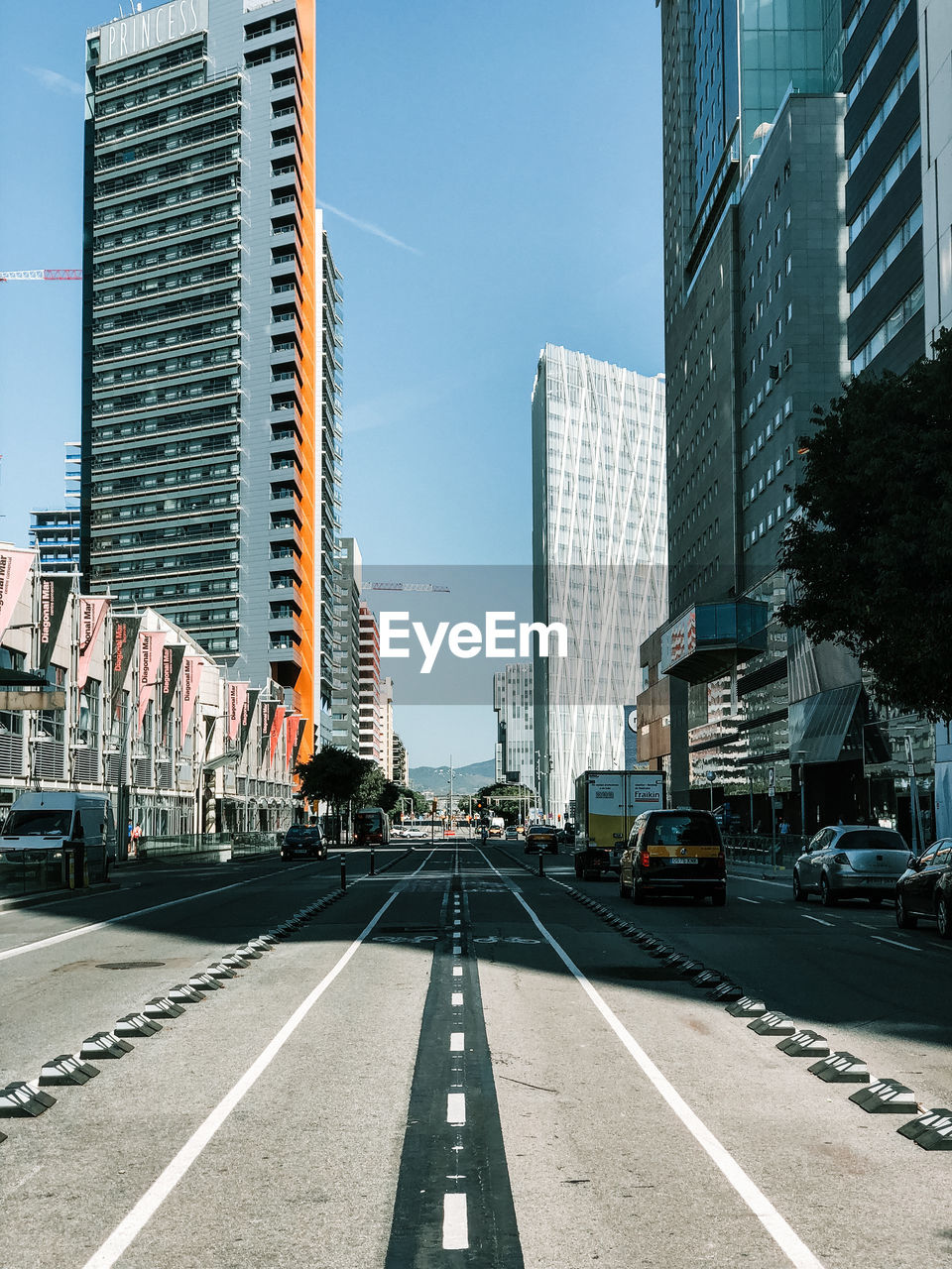 City street and modern buildings against sky