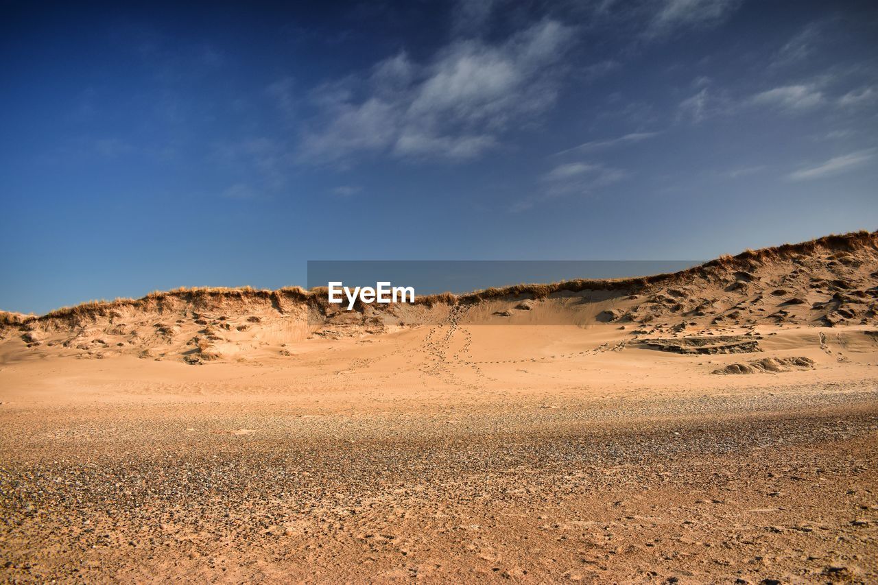 Scenic view of desert against sky