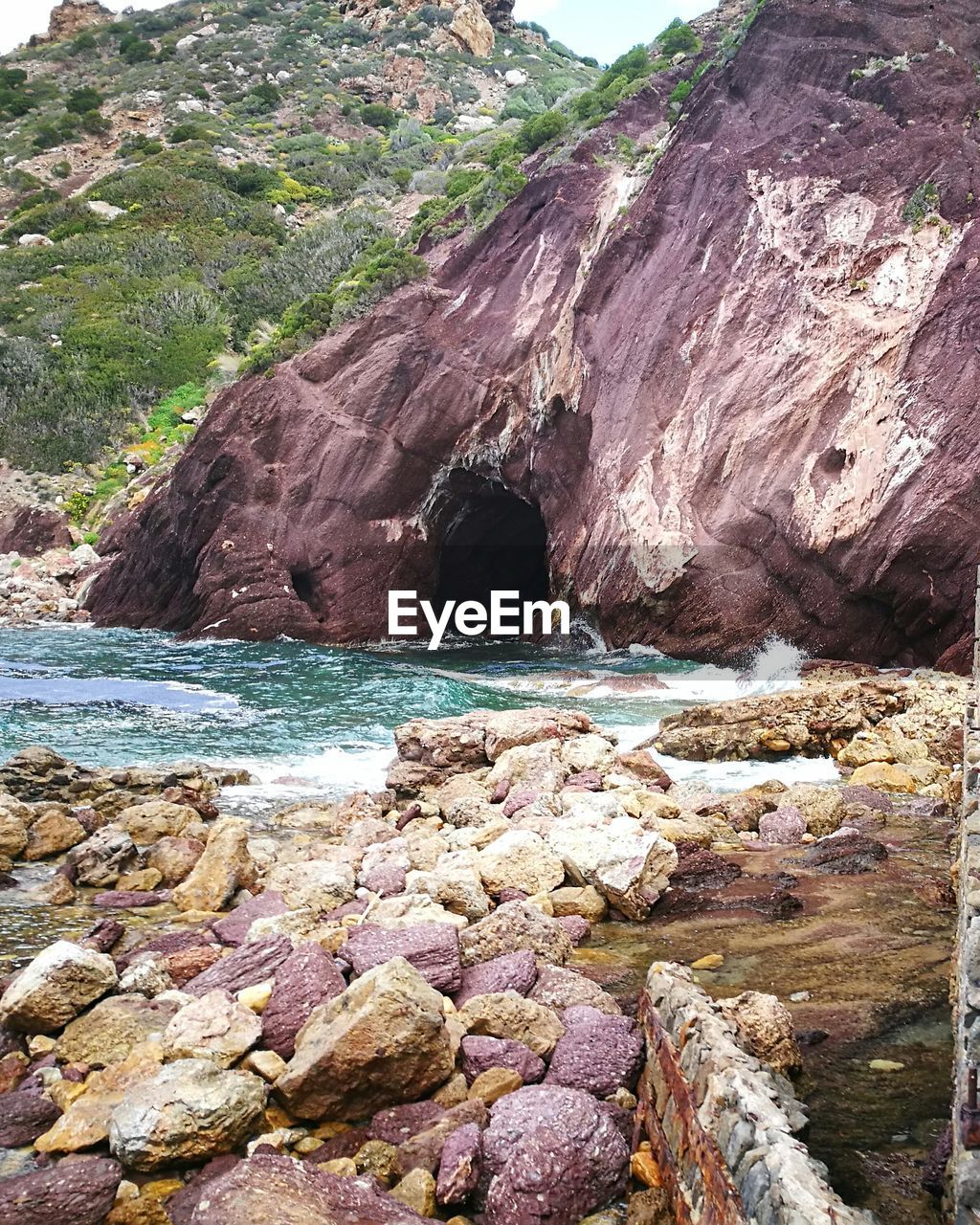 ROCKS ON SHORE AT BEACH