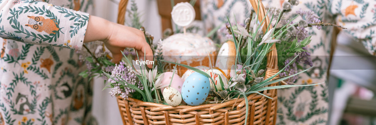 easter, spring, basket, plant, floristry, easter egg, flower, one person, tradition, nature, celebration, egg, flowering plant, adult, container, decoration, holiday, hand, food, floral design, outdoors, focus on foreground, women, selective focus, day, holding, close-up, pattern, food and drink, bouquet, wicker, agriculture, craft