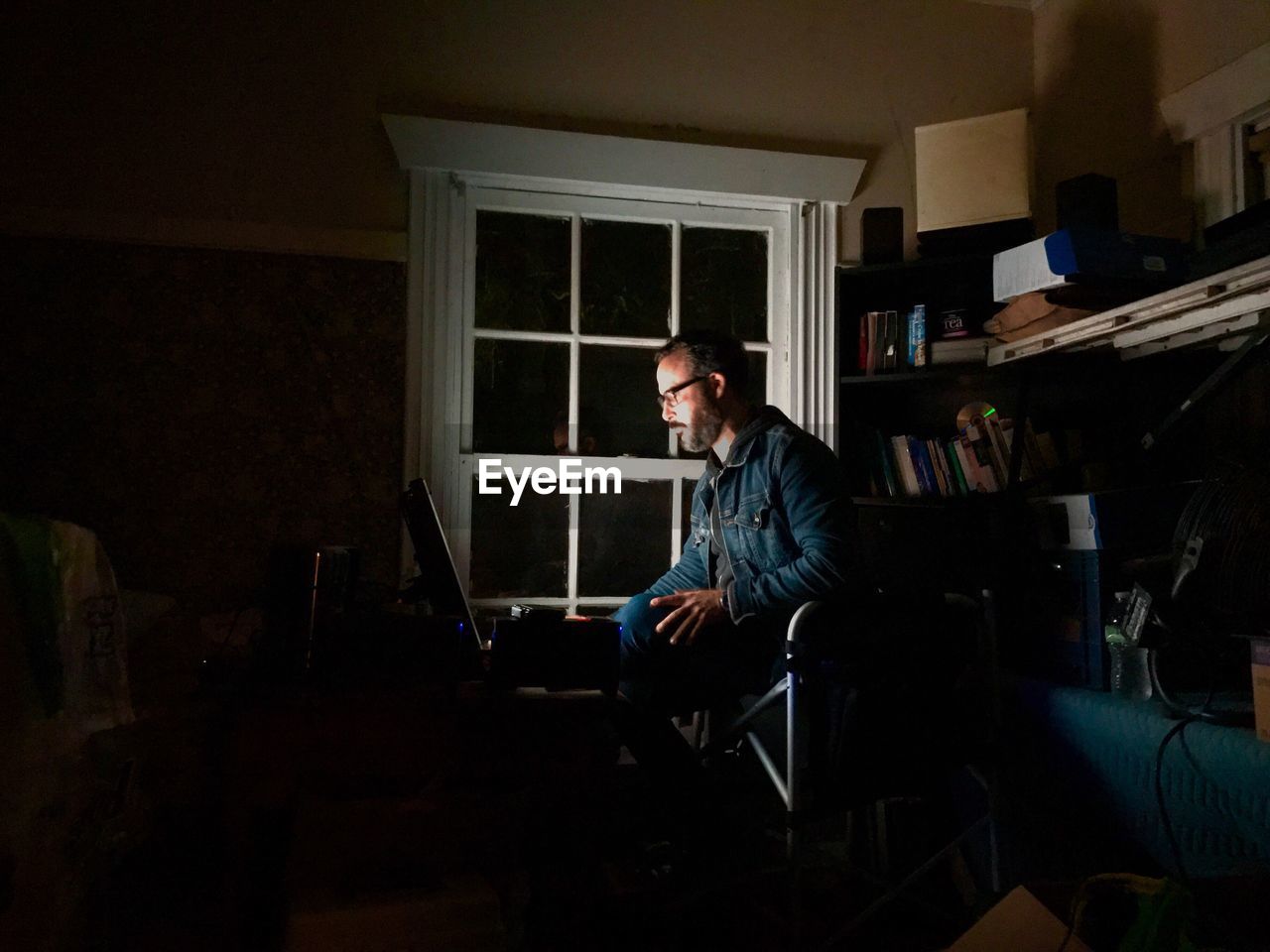 MAN WORKING ON WINDOW