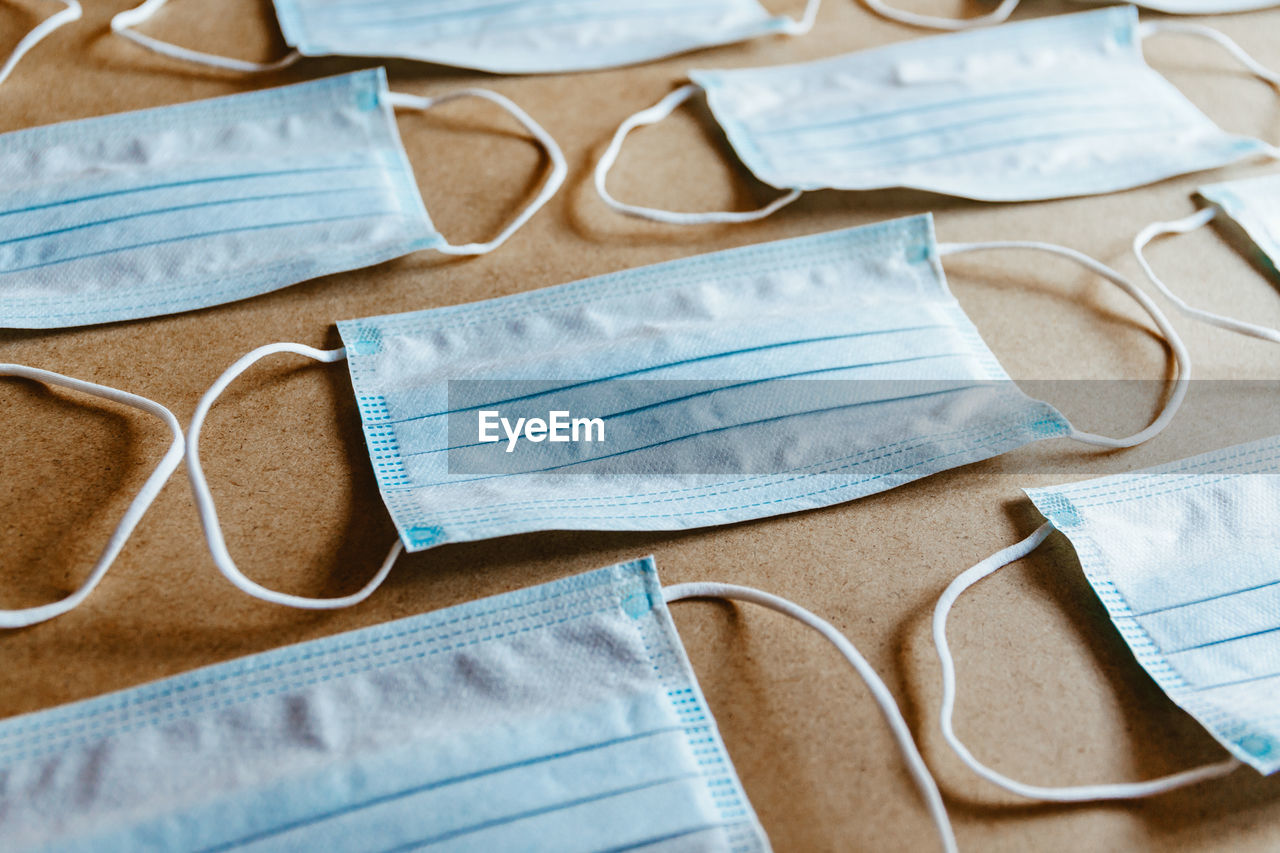 HIGH ANGLE VIEW OF EYEGLASSES AND TABLE