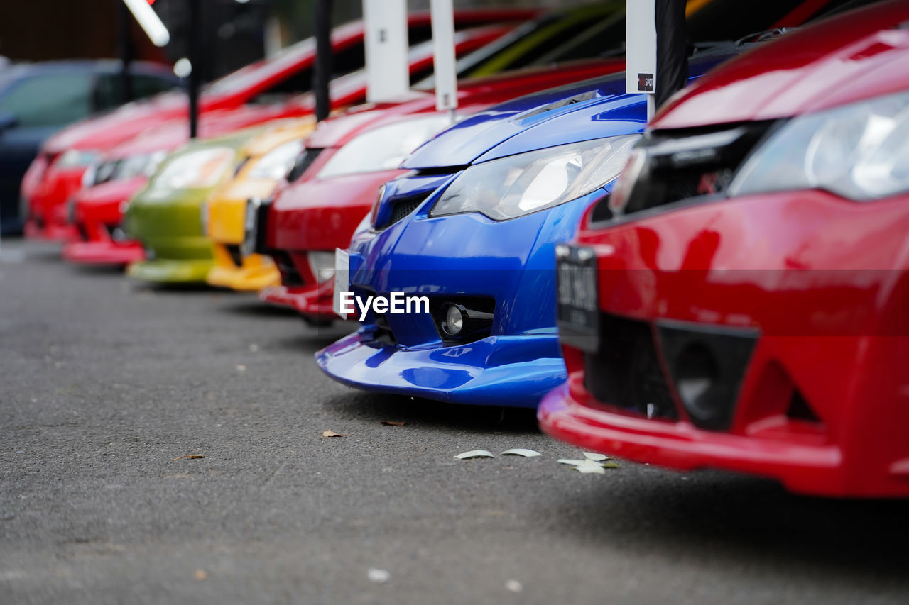 Side view of a japanese sports car, showing the car's bumper.