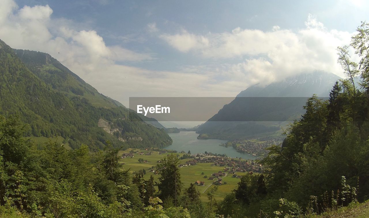 Scenic view of landscape against cloudy sky