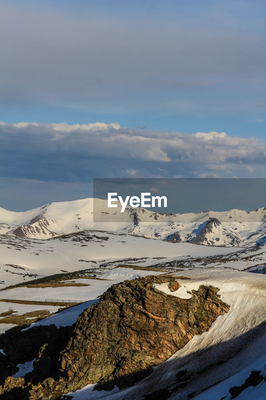 Scenic view of mountains against sky during winter