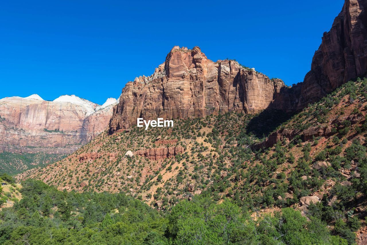 VIEW OF ROCKY MOUNTAIN AGAINST SKY