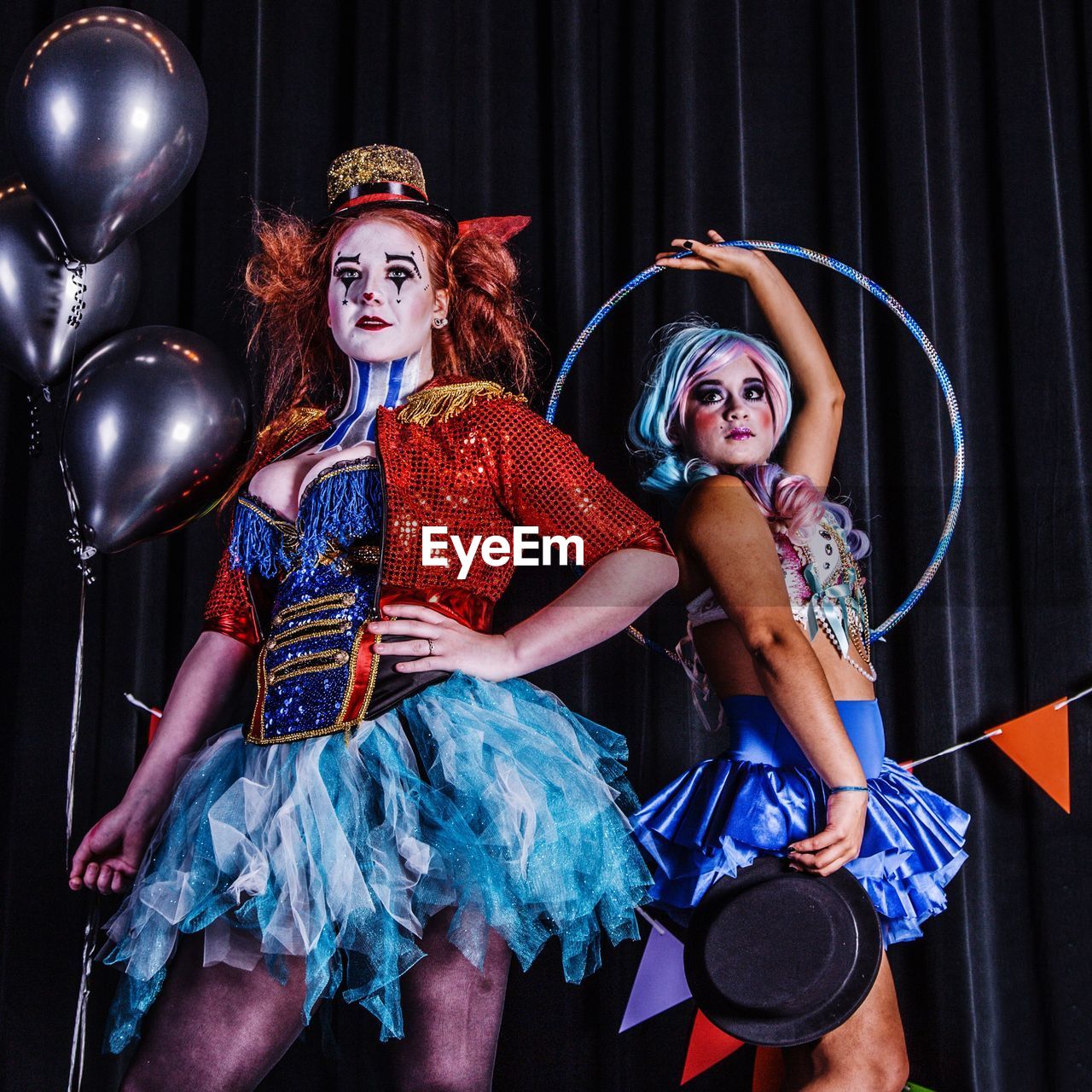 Women in costume standing on stage