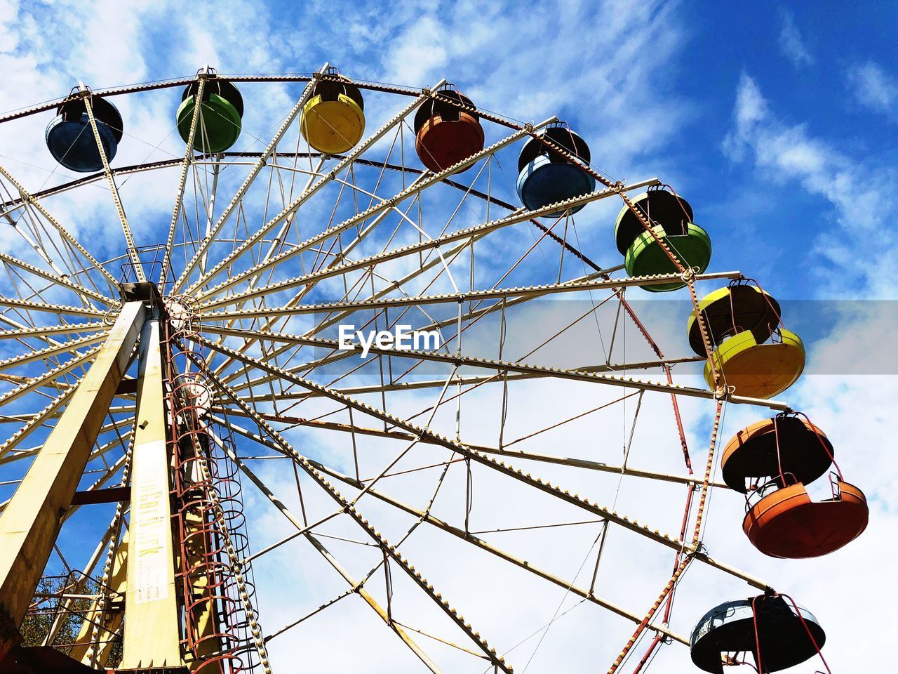 Low angle view of ferris wheel against sky