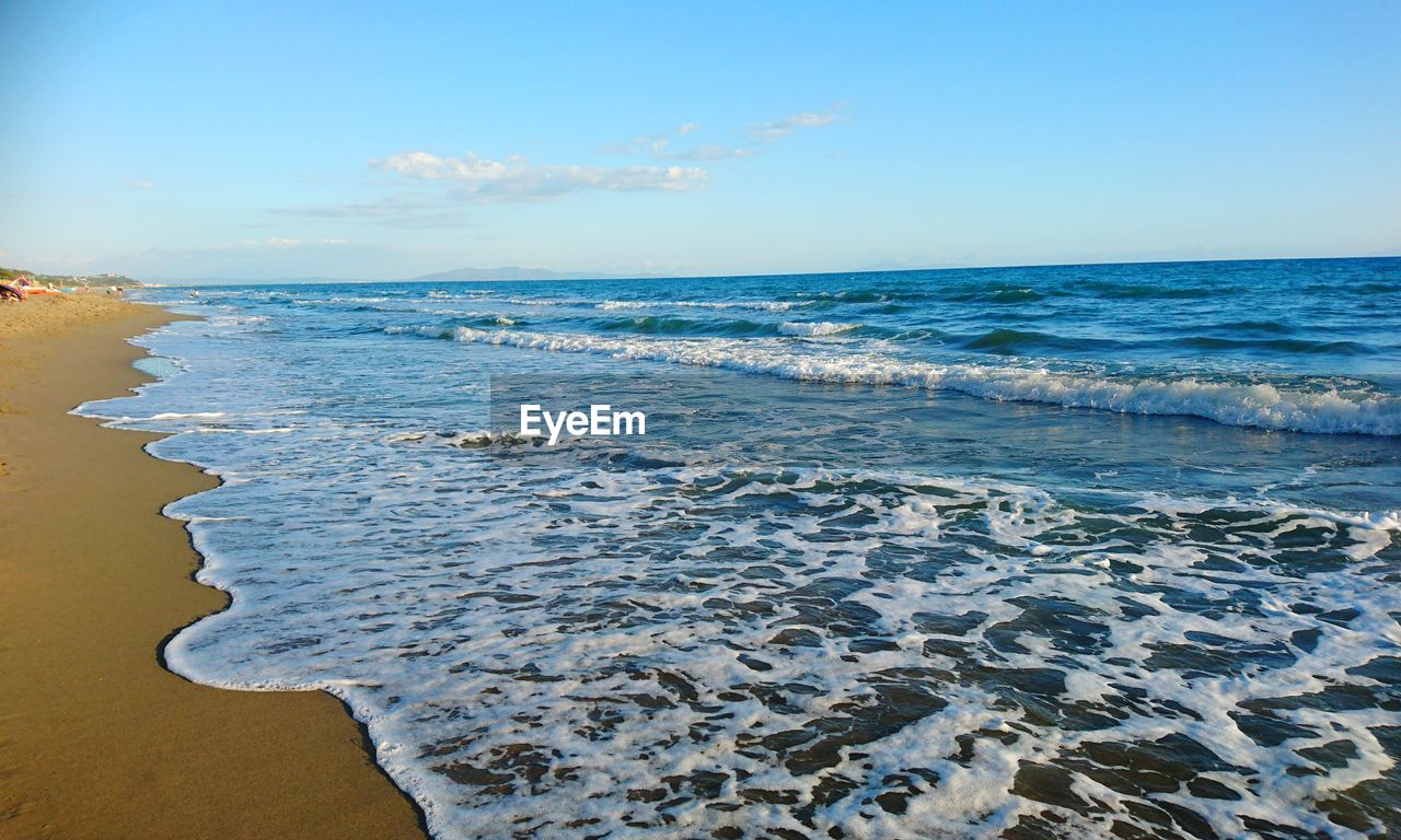 Scenic view of sea against blue sky