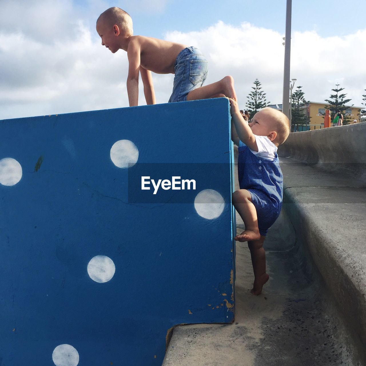 Siblings playing outdoors