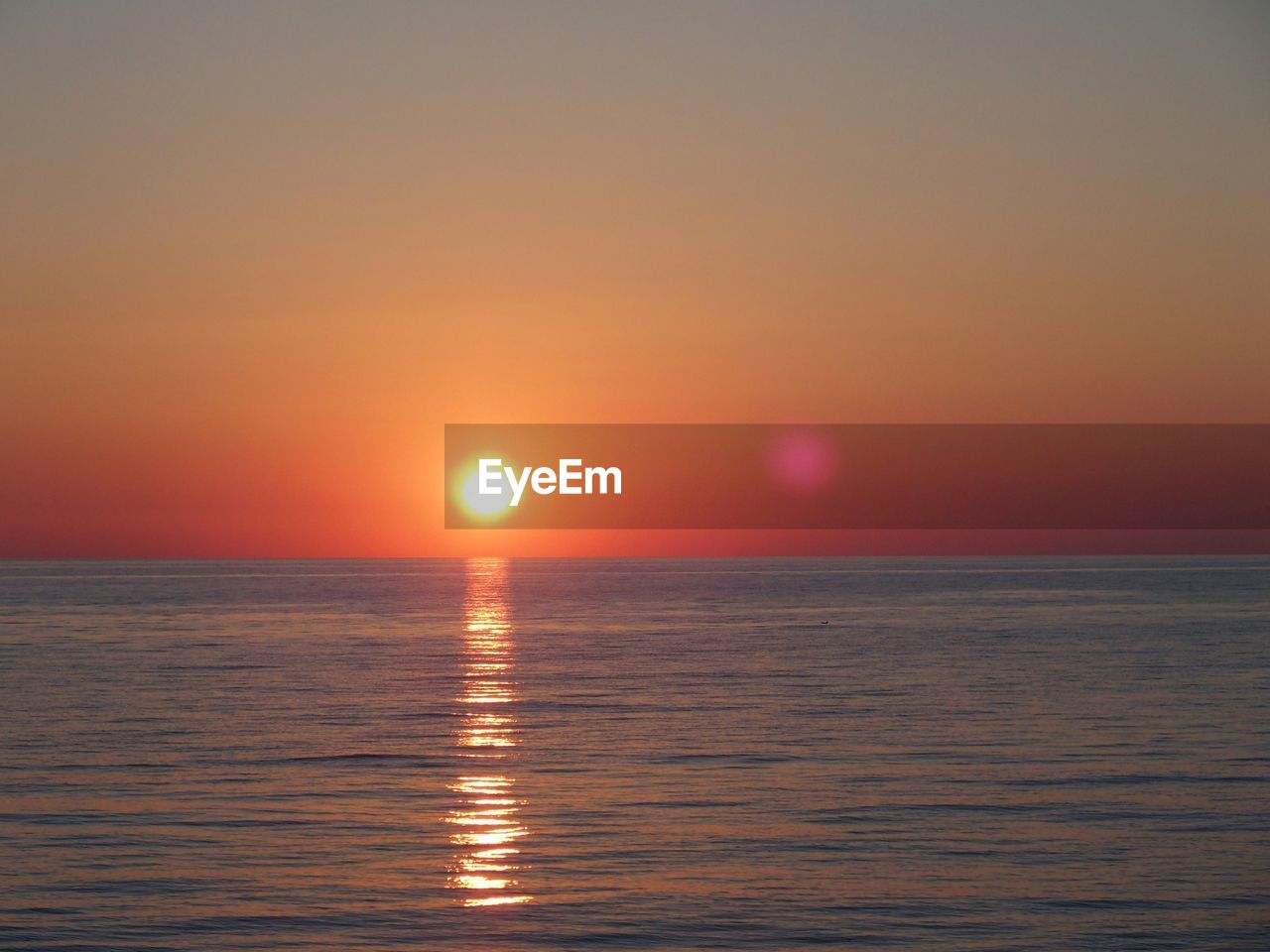 Scenic view of sunset over sea
