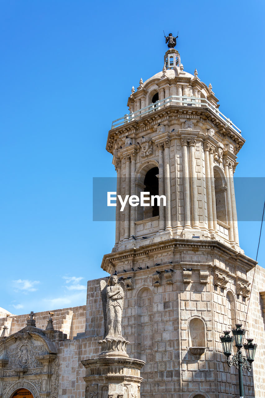 Low angle view of church against blue sky at historic centre of arequipa