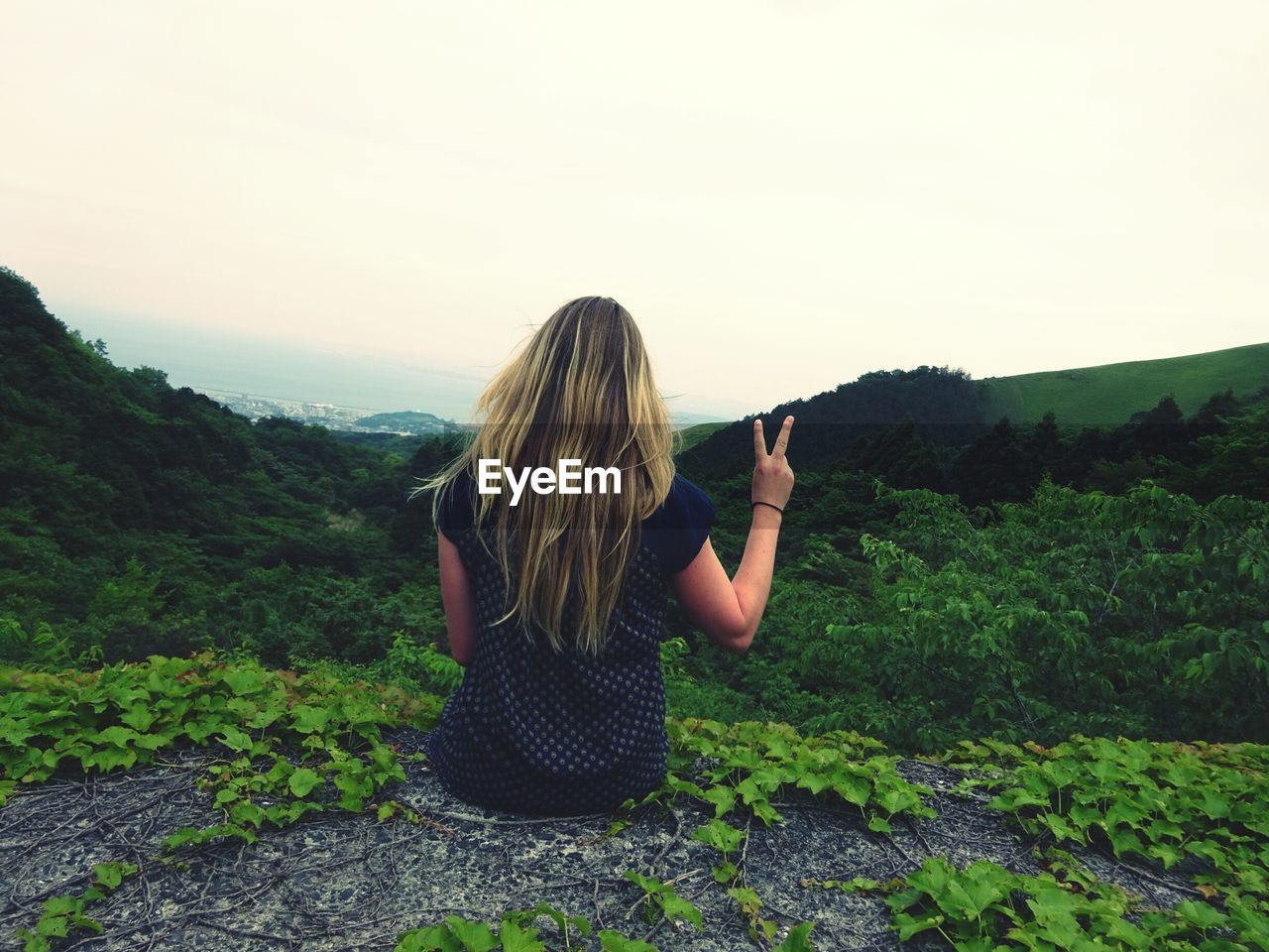 Rear view of woman looking at mountains