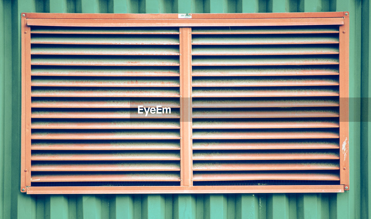 Close-up of closed window of building