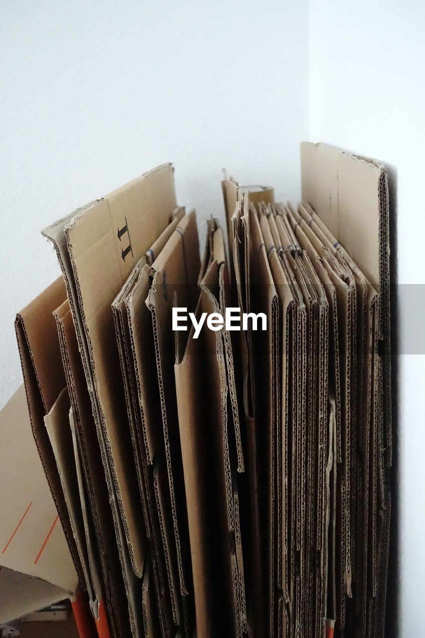 Close-up of cardboard boxes against wall