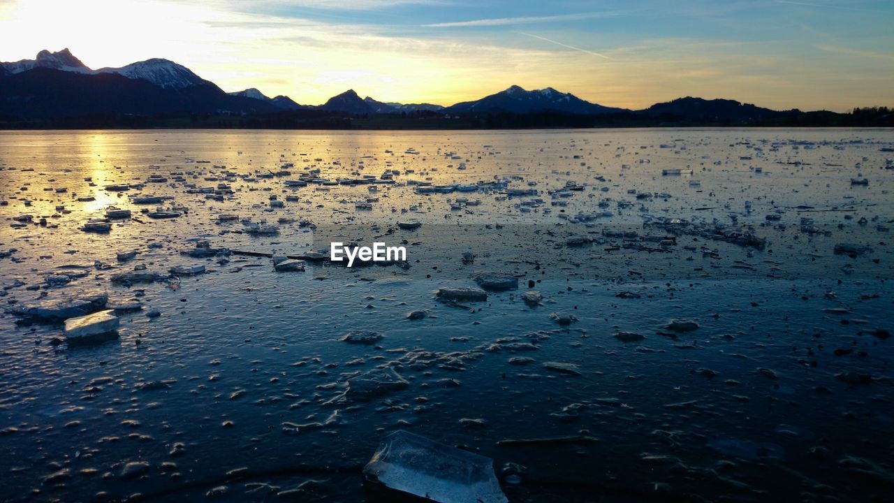 Frozen lake against sky