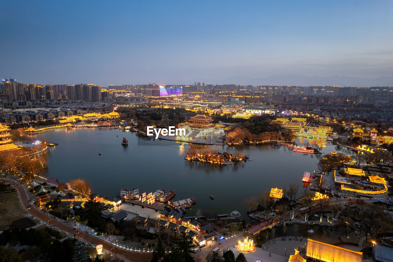 High angle view of illuminated buildings in city