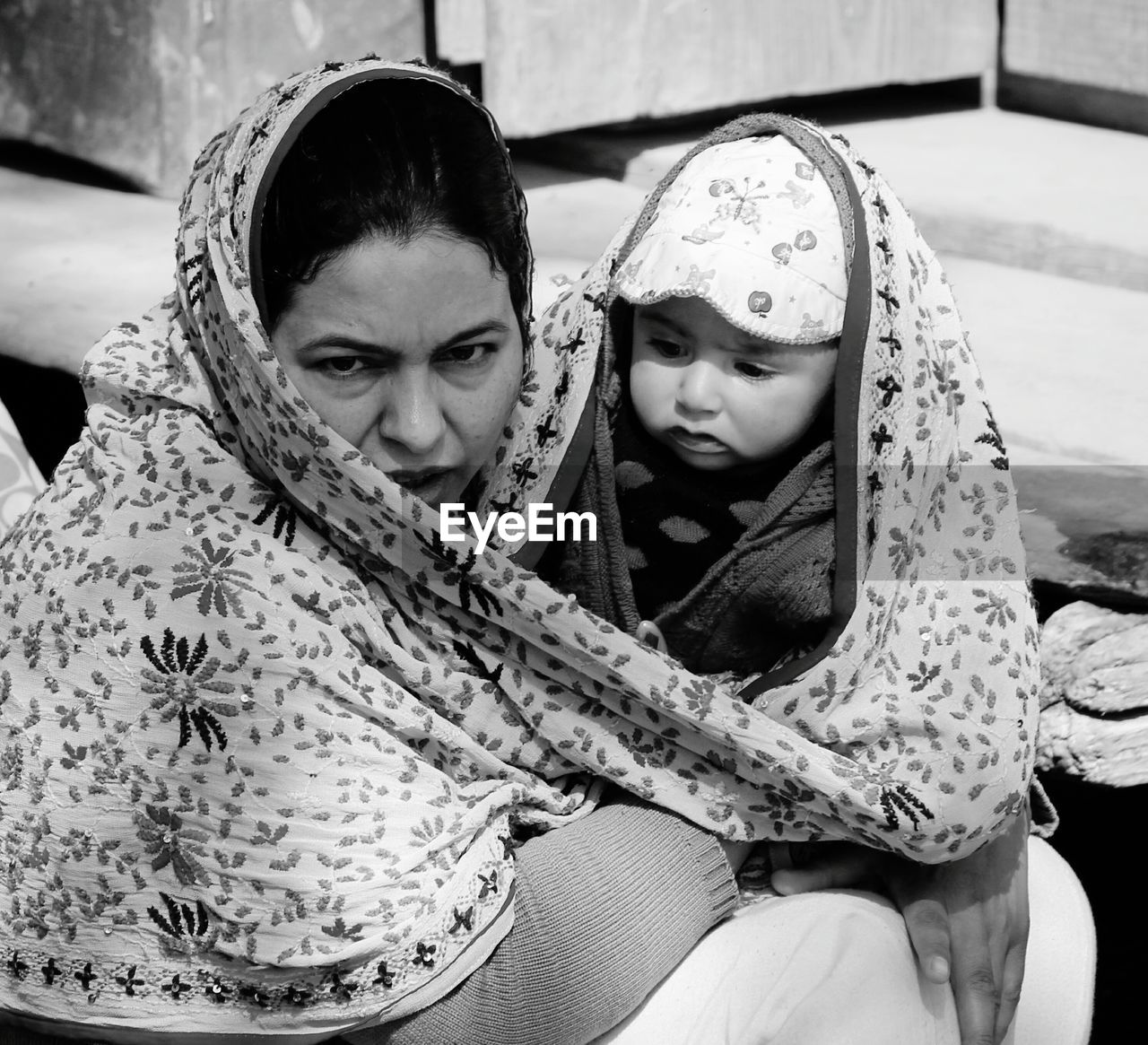 Portrait of mother with baby wrapped in dupatta