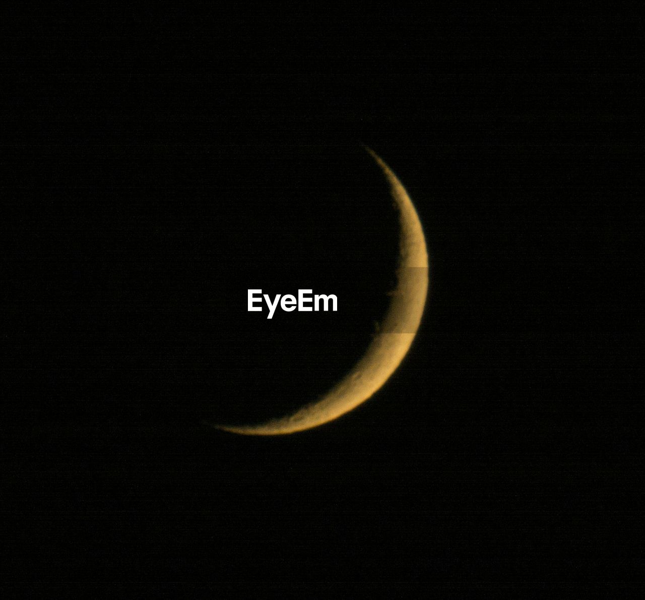 VIEW OF MOON OVER DARK BACKGROUND