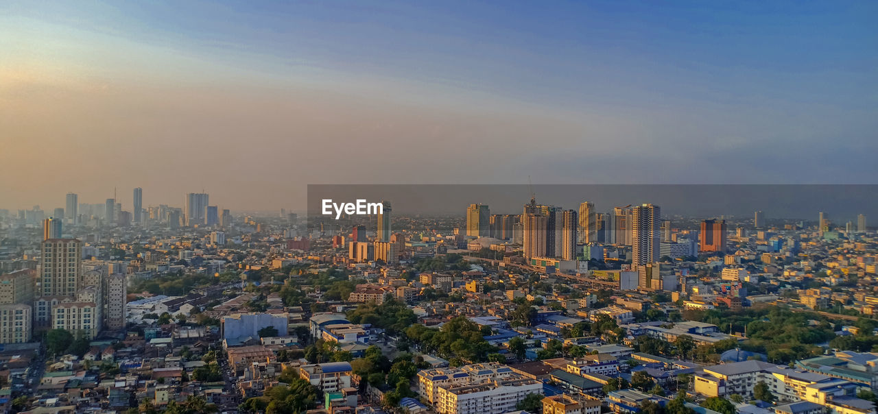 High angle view of modern buildings in city against sky