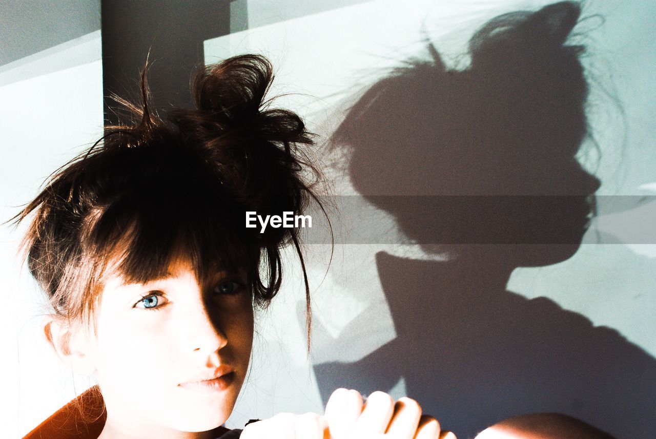 Portrait of girl with messy hair at home