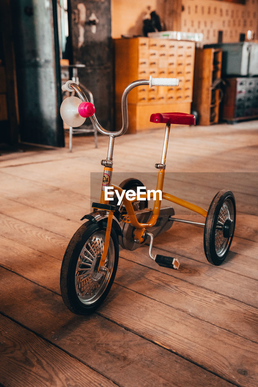 BICYCLE WITH TOY ON TABLE