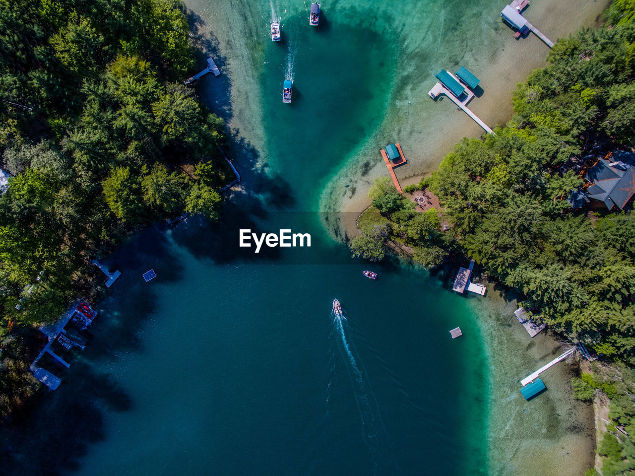Aerial view of boats sailing in river