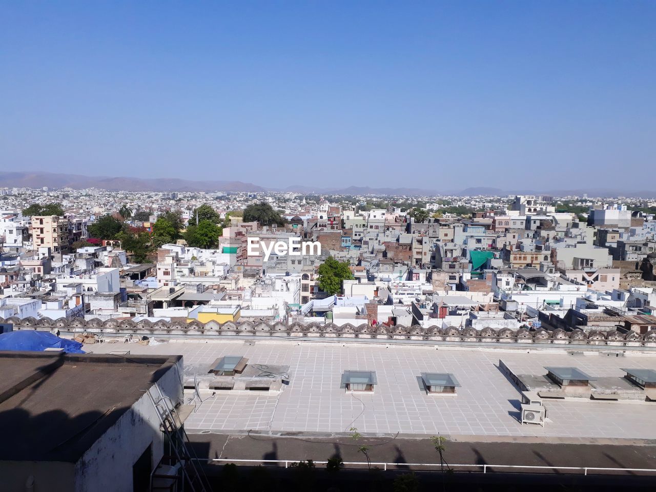 High angle view of townscape against clear blue sky