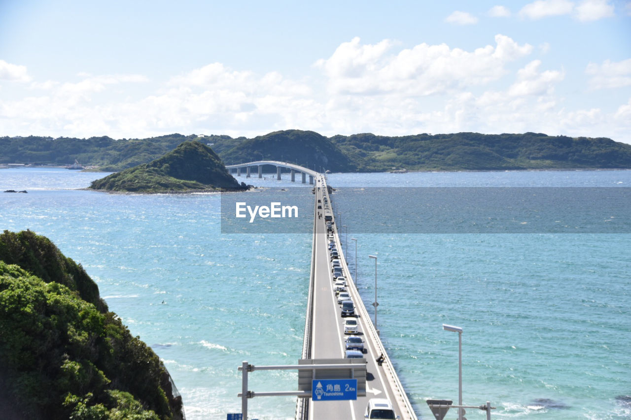 Scenic view of bay against sky. this bridge is called tsunoshima ohhashi .